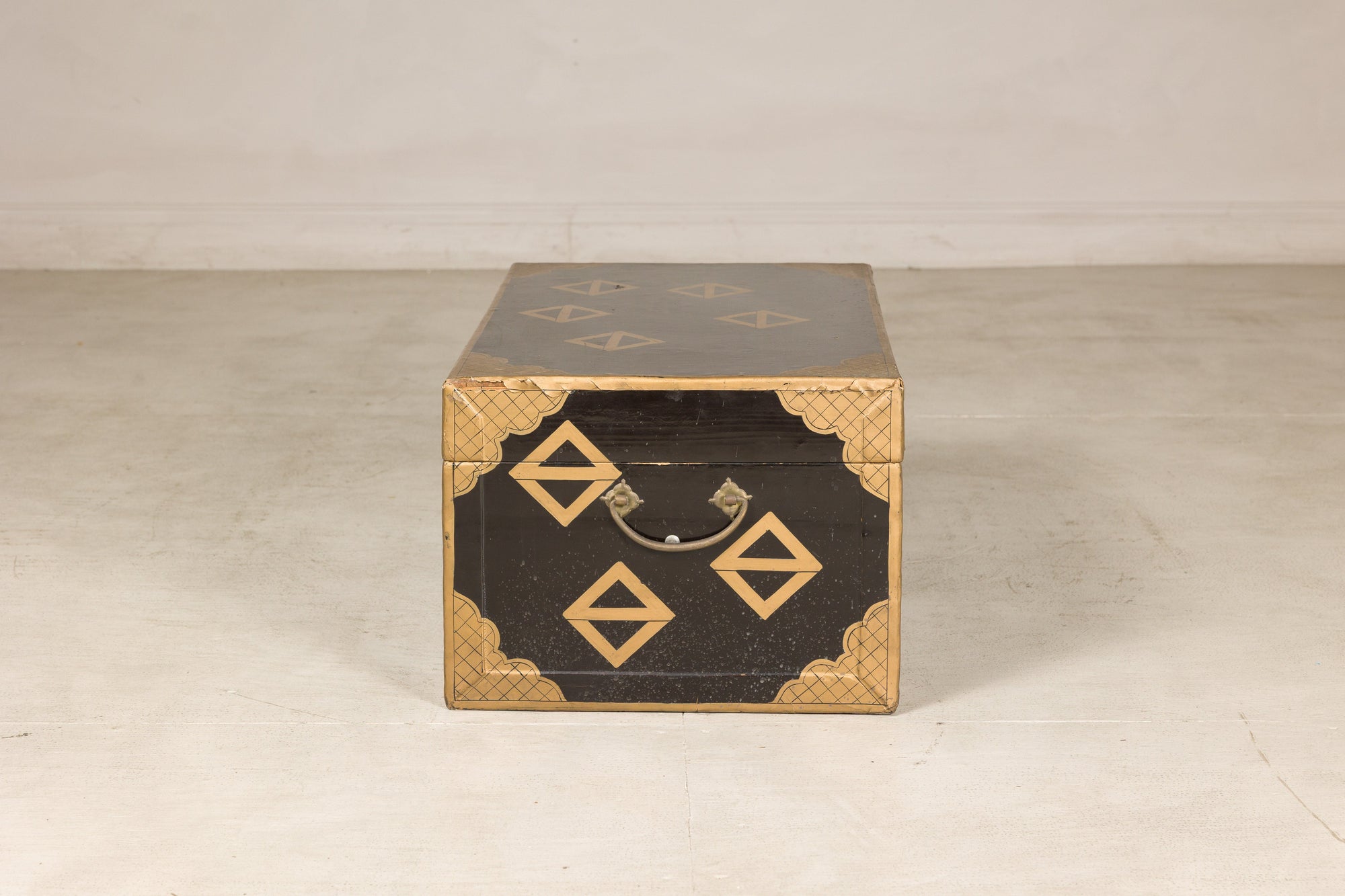 Opposite end view of black lacquered storage chest