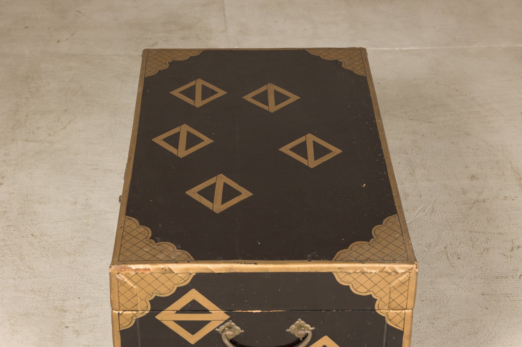 Black lacquered chest, angled top and front view