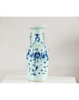 Blue and white ceramic vase with painted scenes and celadon glaze, displayed on a white surface.