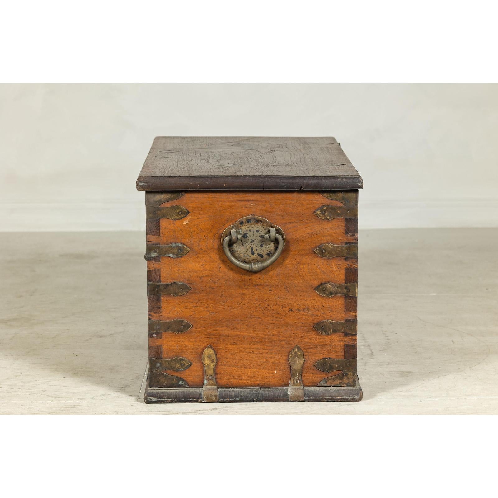 Antique Wooden Trunk with Ornamental Metalwork and Brass Hardware