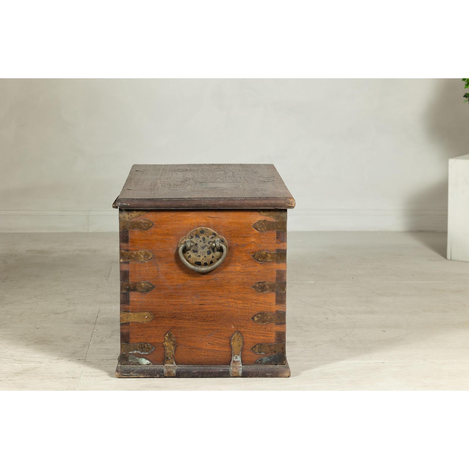 Antique Wooden Trunk with Ornamental Metalwork and Brass Hardware