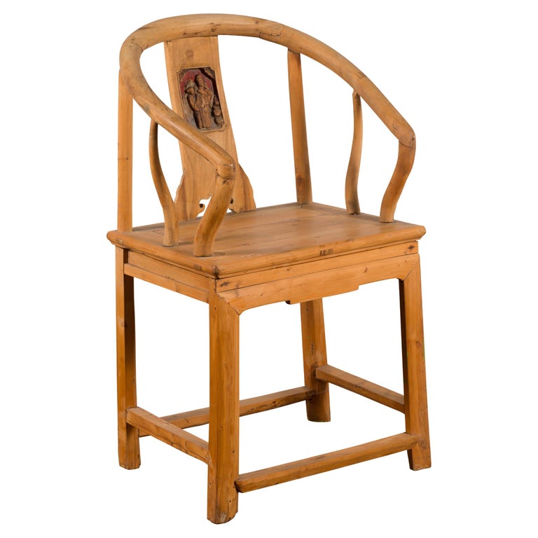 Brown elmwood Qing Dynasty chair with carved character medallion in traditional Asian style, 19th century.