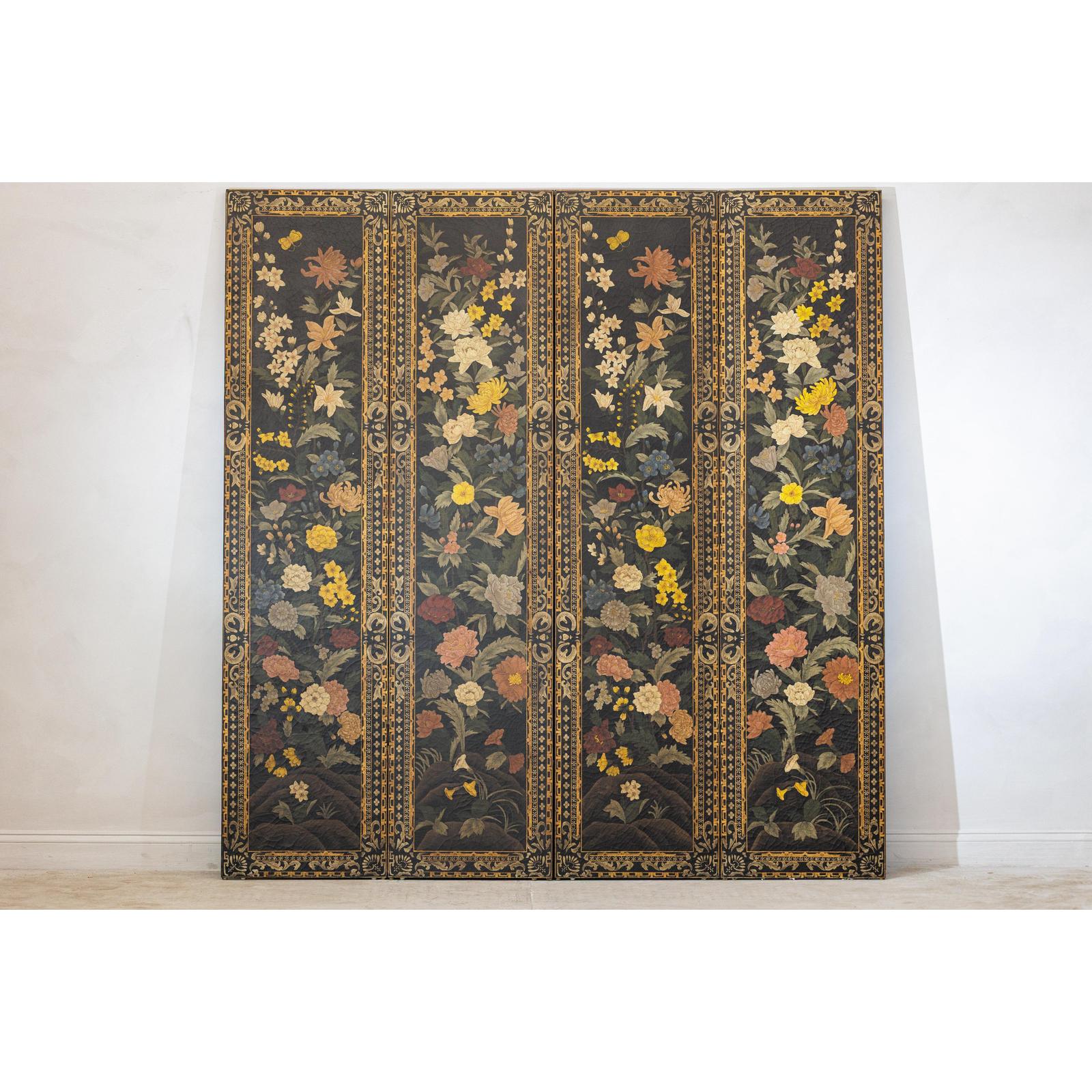 Black lacquer four-panel folding screen with multicolored ornate floral design, leaning against a wall.