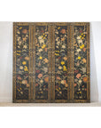 Black lacquer four-panel folding screen with multicolored ornate floral design, leaning against a wall.