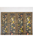 Black four-panel screen with multicolored floral design and ornate borders, polychrome pattern visible on each panel.