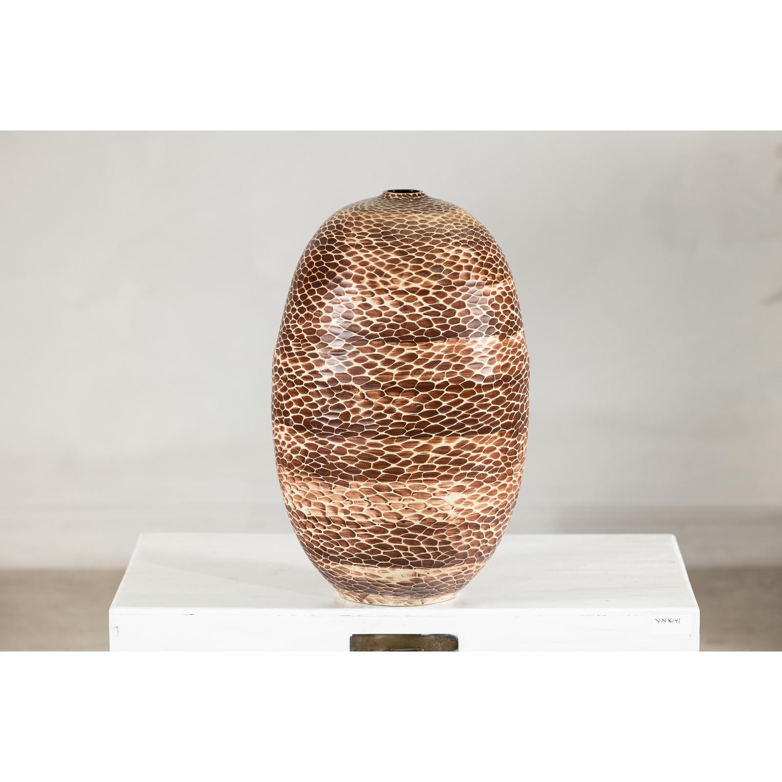 Neutral-toned ceramic vase with snakeskin textured glaze, displayed on white surface against a plain background.