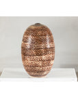 Large ceramic vase with snakeskin textured glaze, neutral color, displayed on white pedestal against plain background.