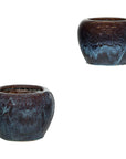 Close-up of vintage blue and aqua glazed ceramic planters, pair on white background.
