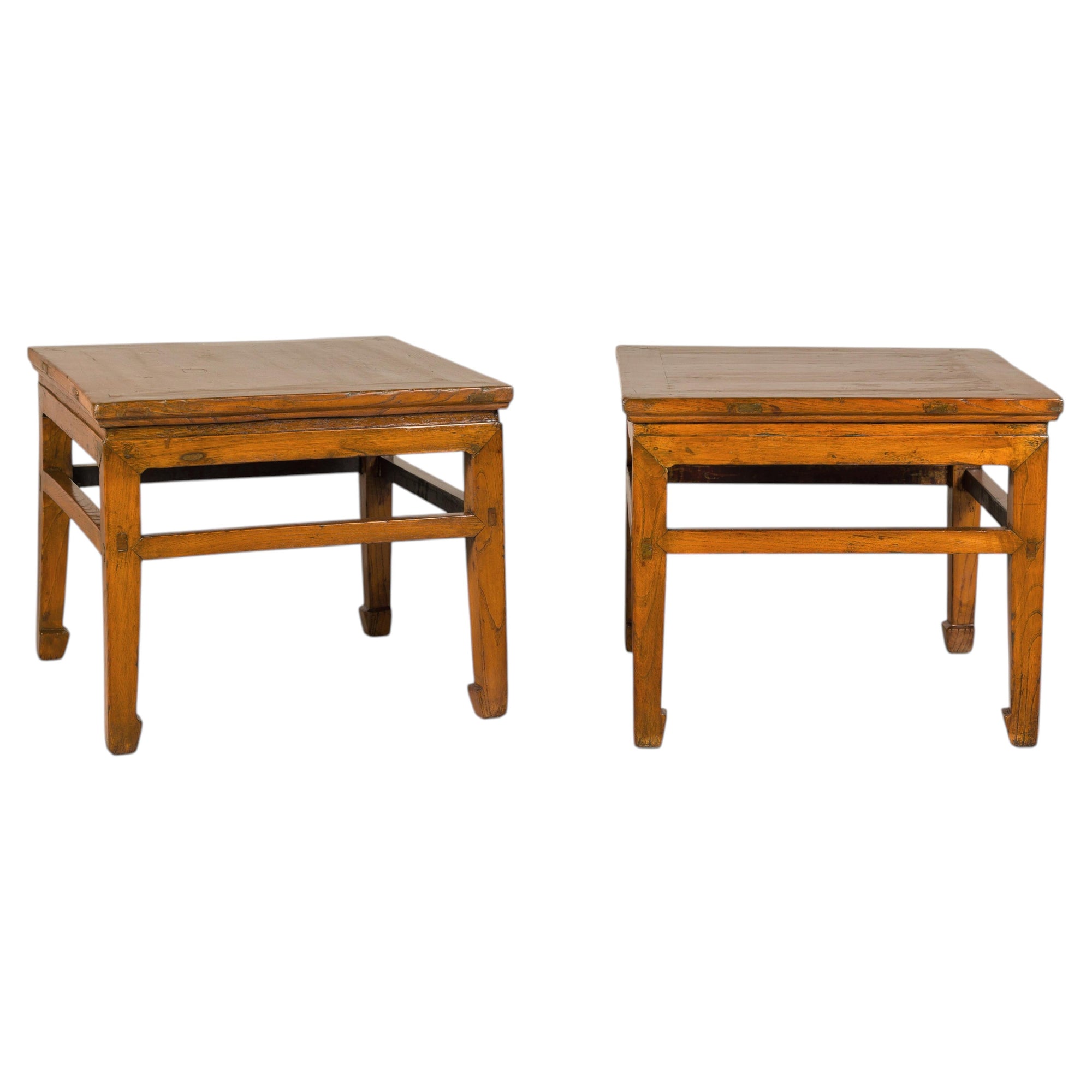 Pair of Qing elmwood side tables on white background