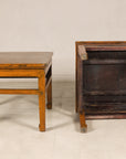 One elm side table upright and one overturned showing underside