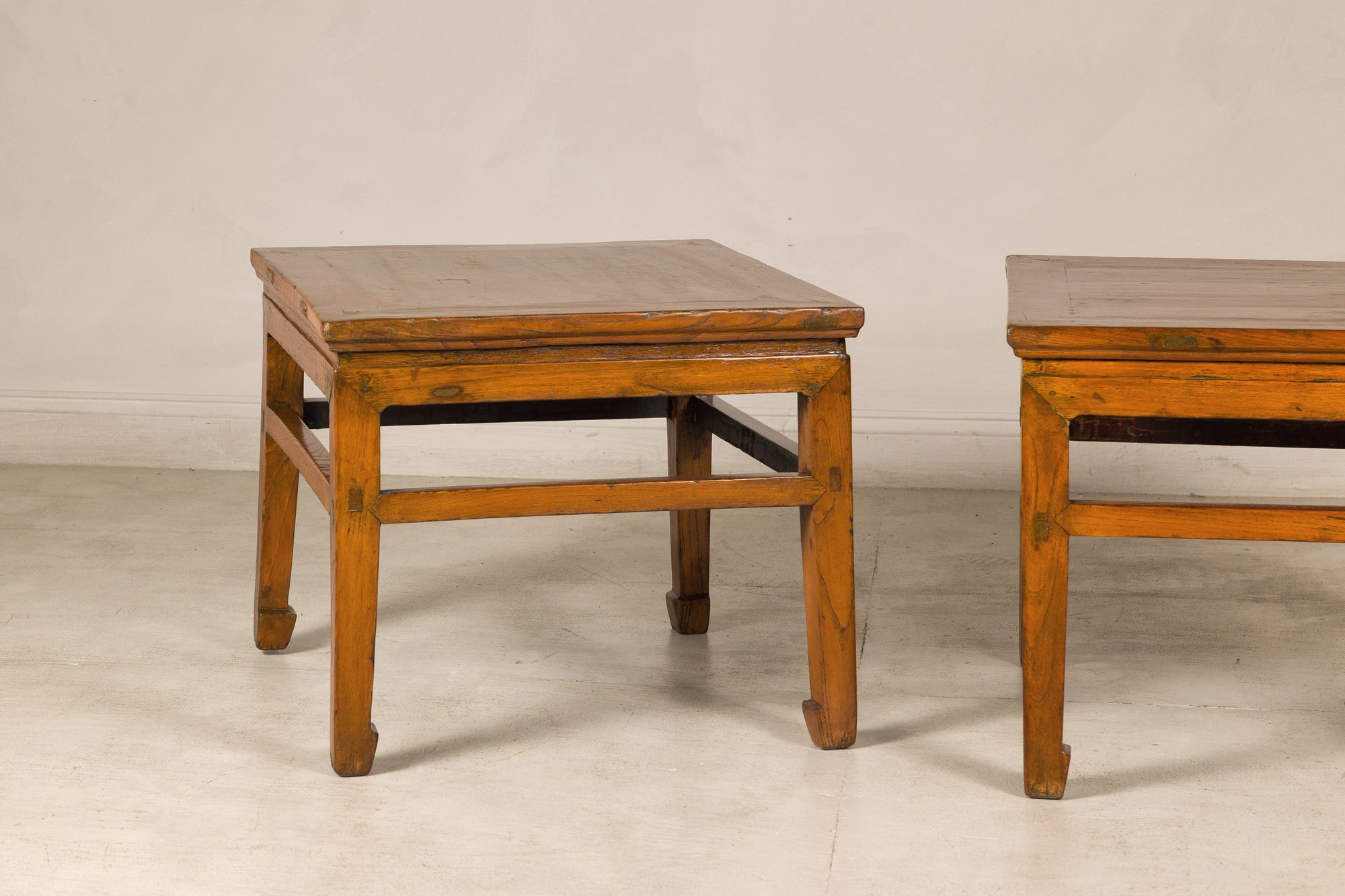Pair of elm side tables, front view with one partly visible