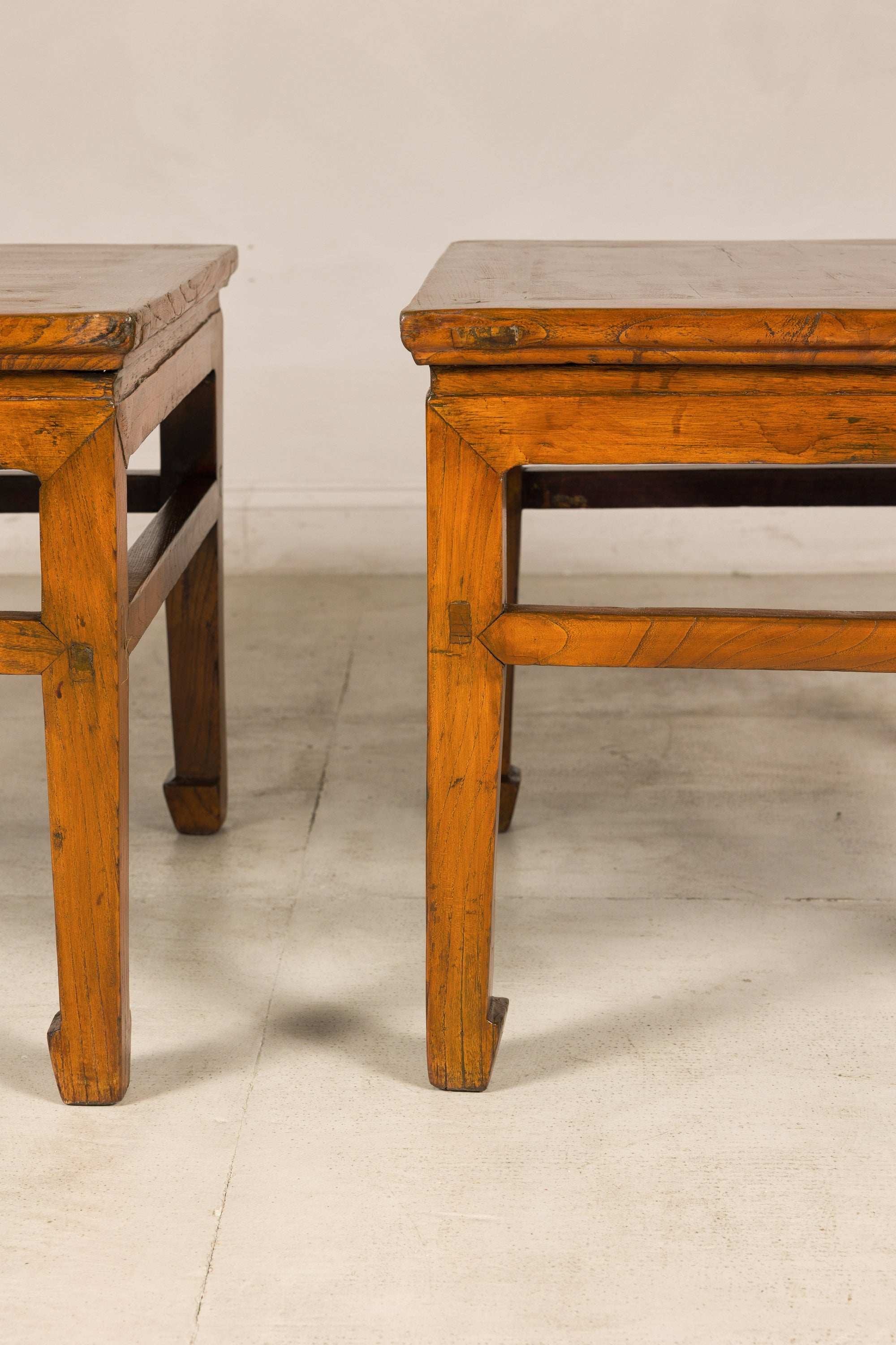 Pair of Chinese elm side tables, partial side and front view