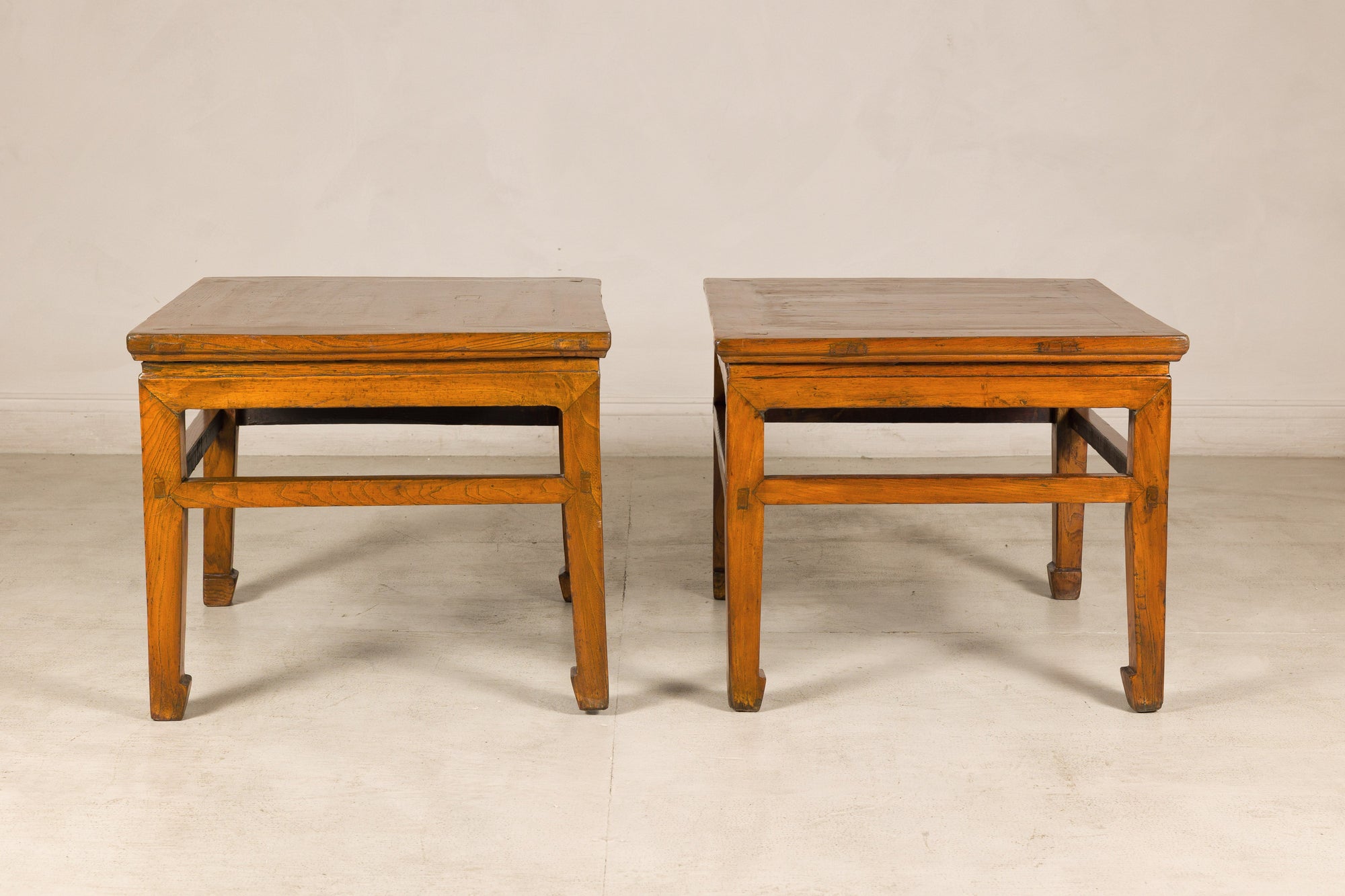 Pair of elm side tables shown at slightly different angles