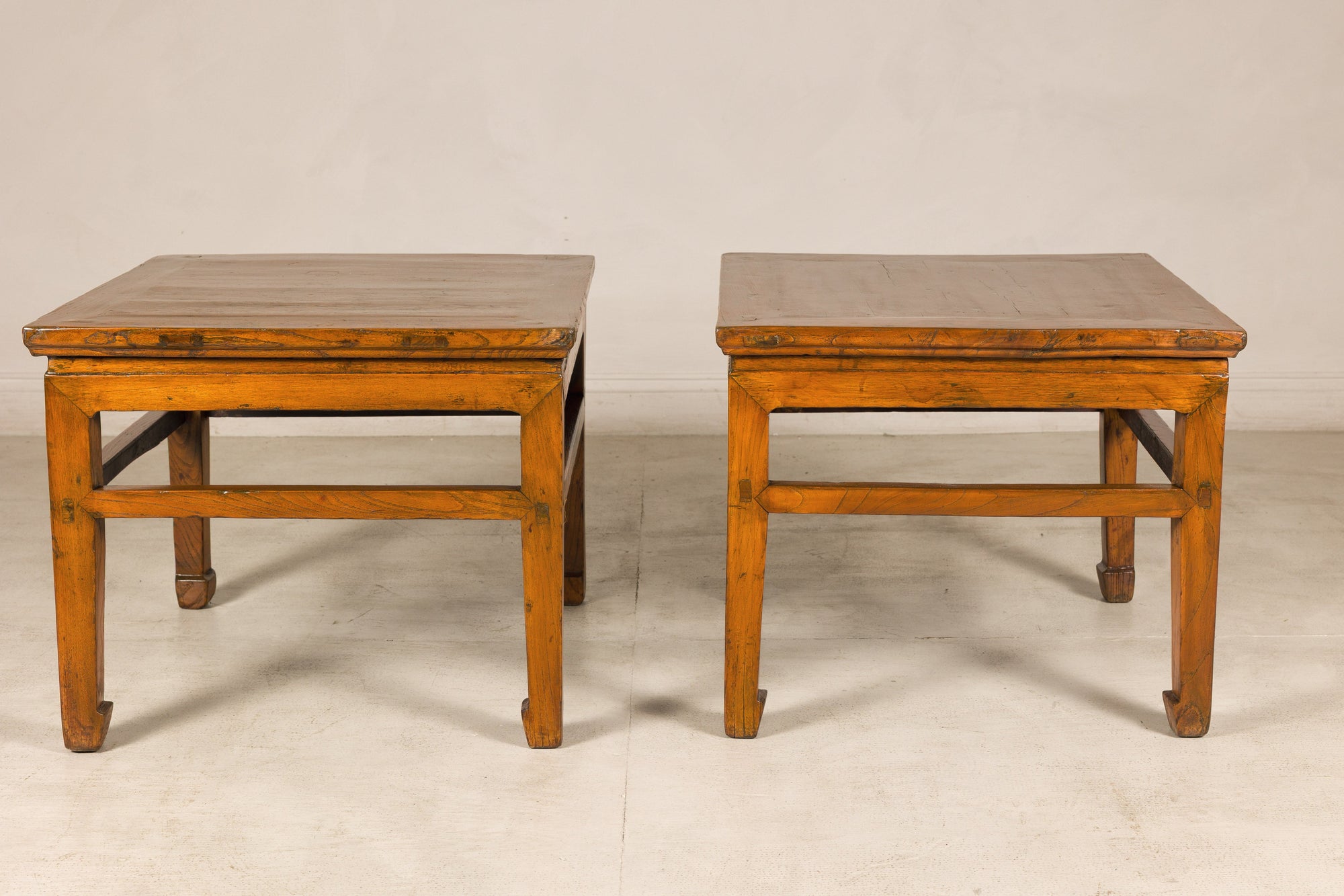 Pair of Chinese side tables, straight-on front view