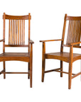 Pair of teak Dutch Colonial dining armchairs rotating view