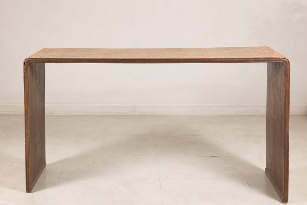 Woven rattan and wood waterfall console table rotating view