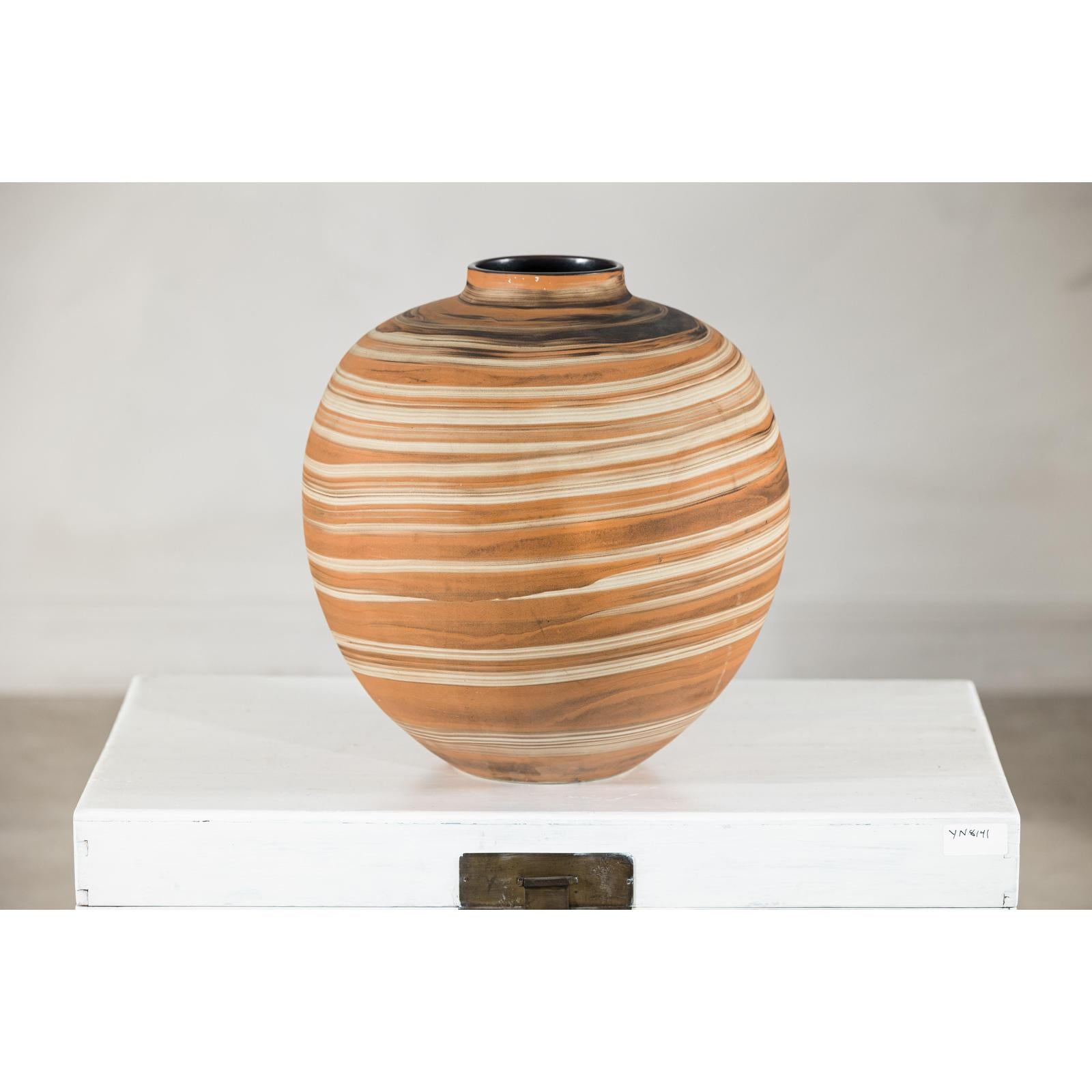 Round Ceramic Artisan Vase with Swirled Earth-Tone Design