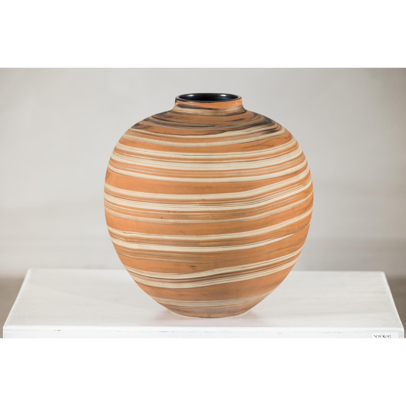 Round Ceramic Artisan Vase with Swirled Earth-Tone Design