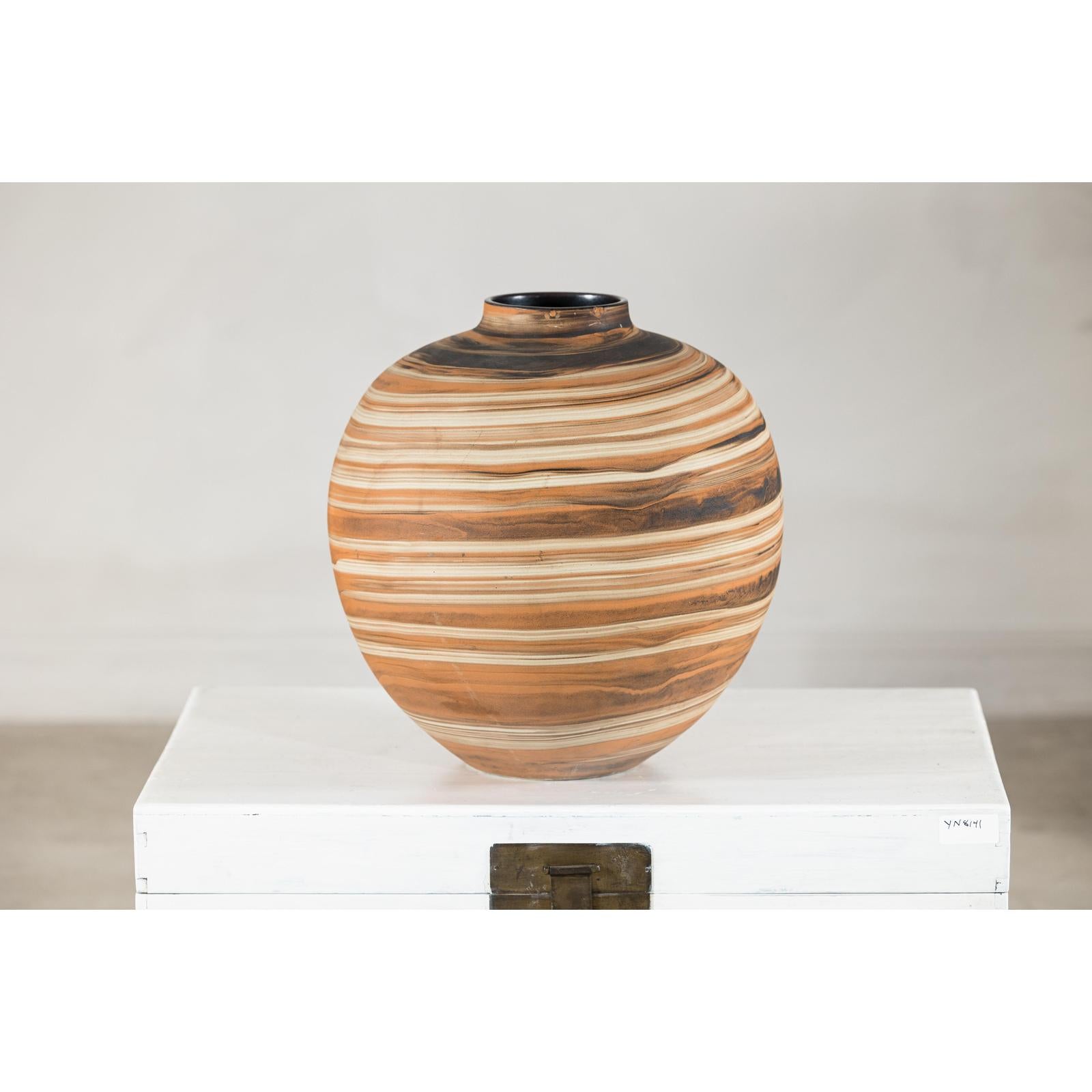 Round Ceramic Artisan Vase with Swirled Earth-Tone Design