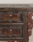 Close-up of cabinet top, drawers and carved side