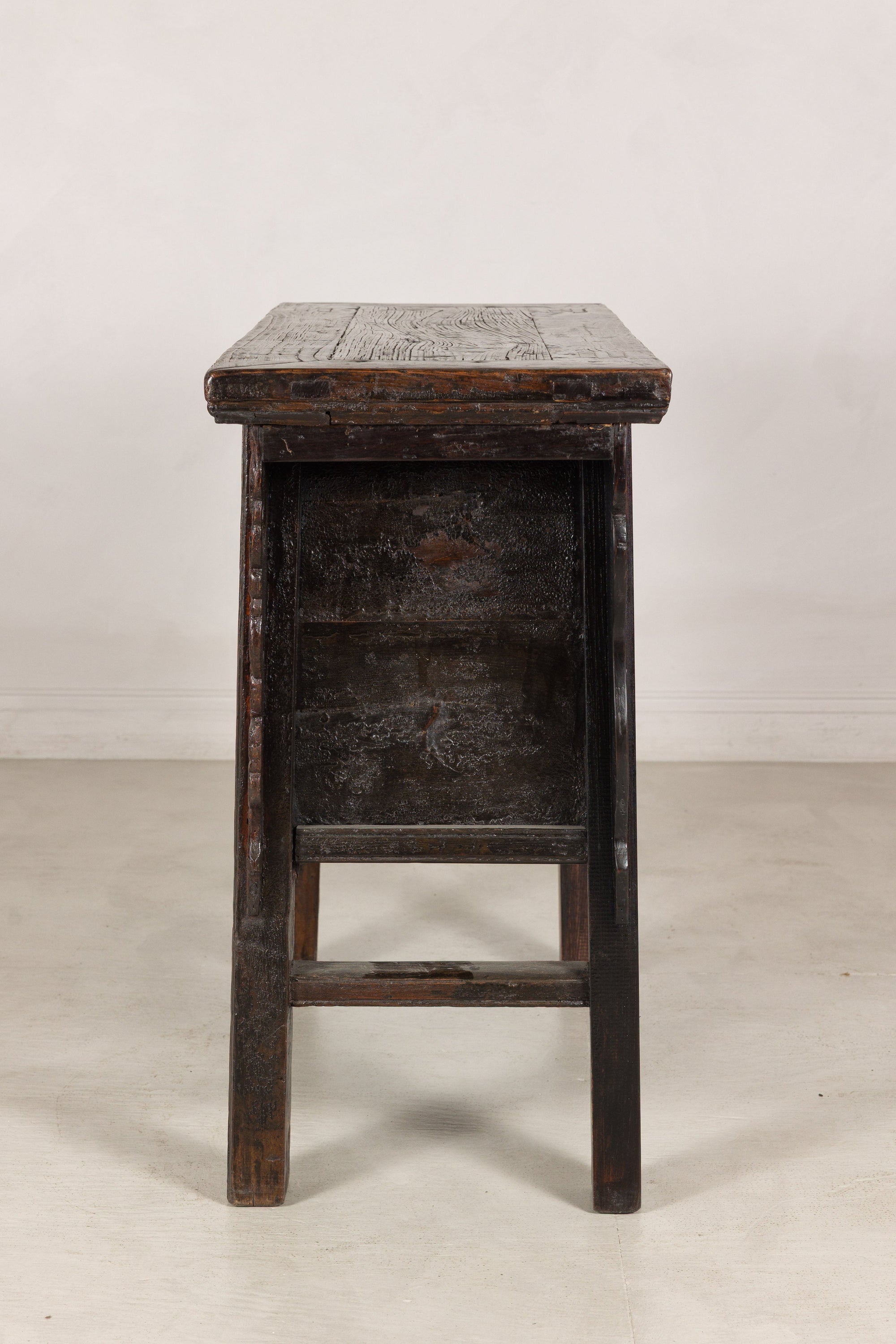 Opposite side view of rustic carved cabinet