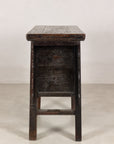 Opposite side view of rustic carved cabinet