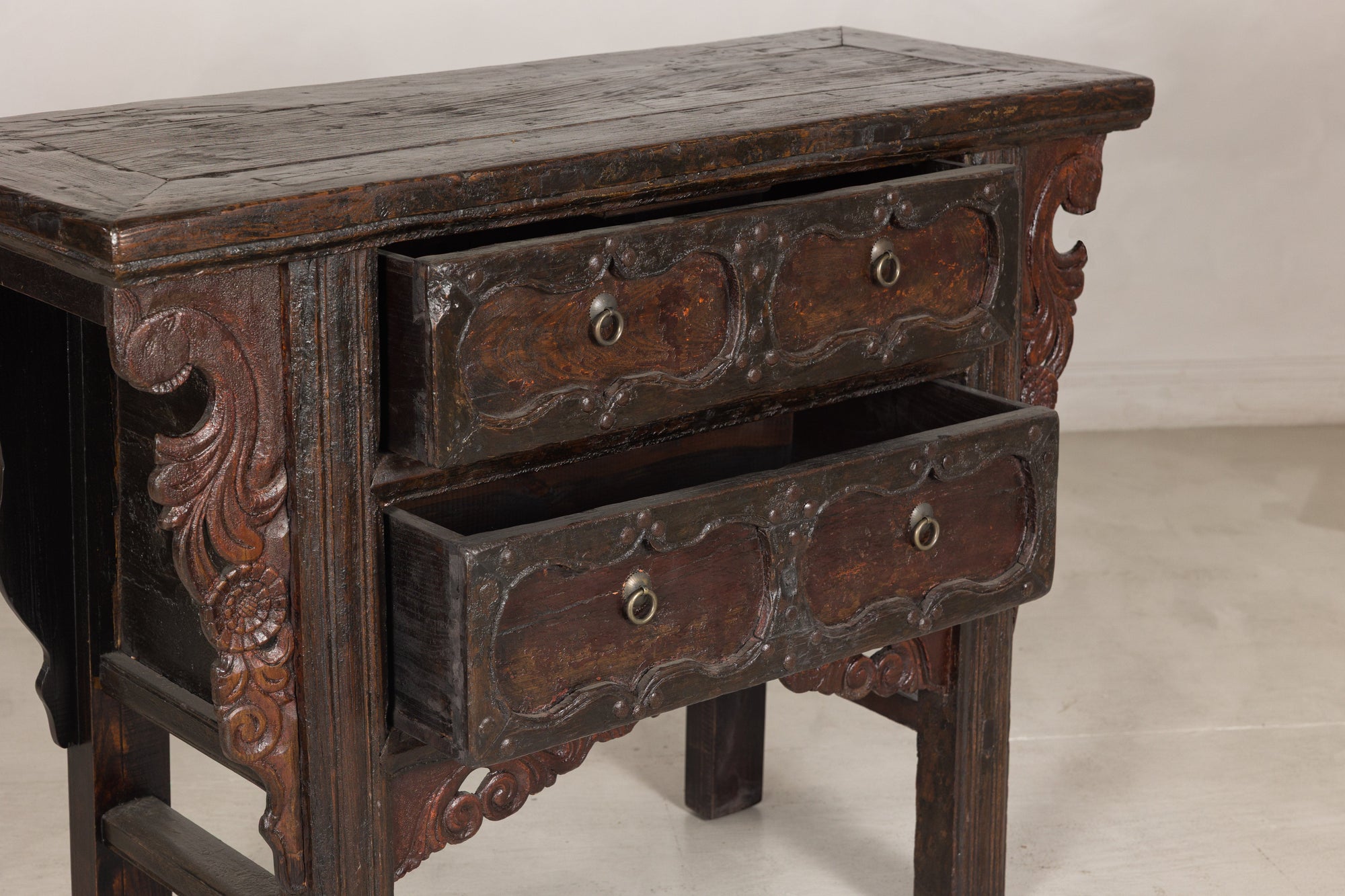 Three-quarter view of cabinet with lower drawer open