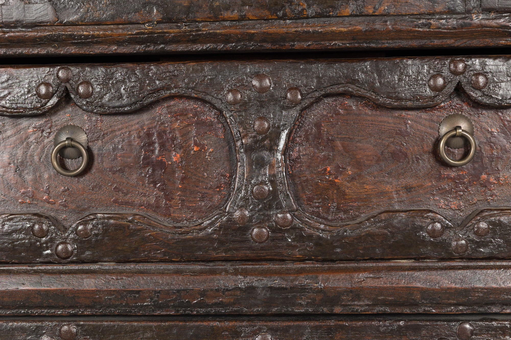 Close-up of drawer fronts and brass ring pulls