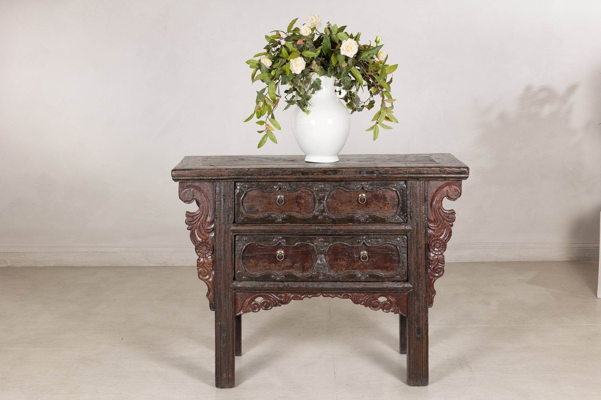 Rustic Qing dynasty carved cabinet styled with a vase
