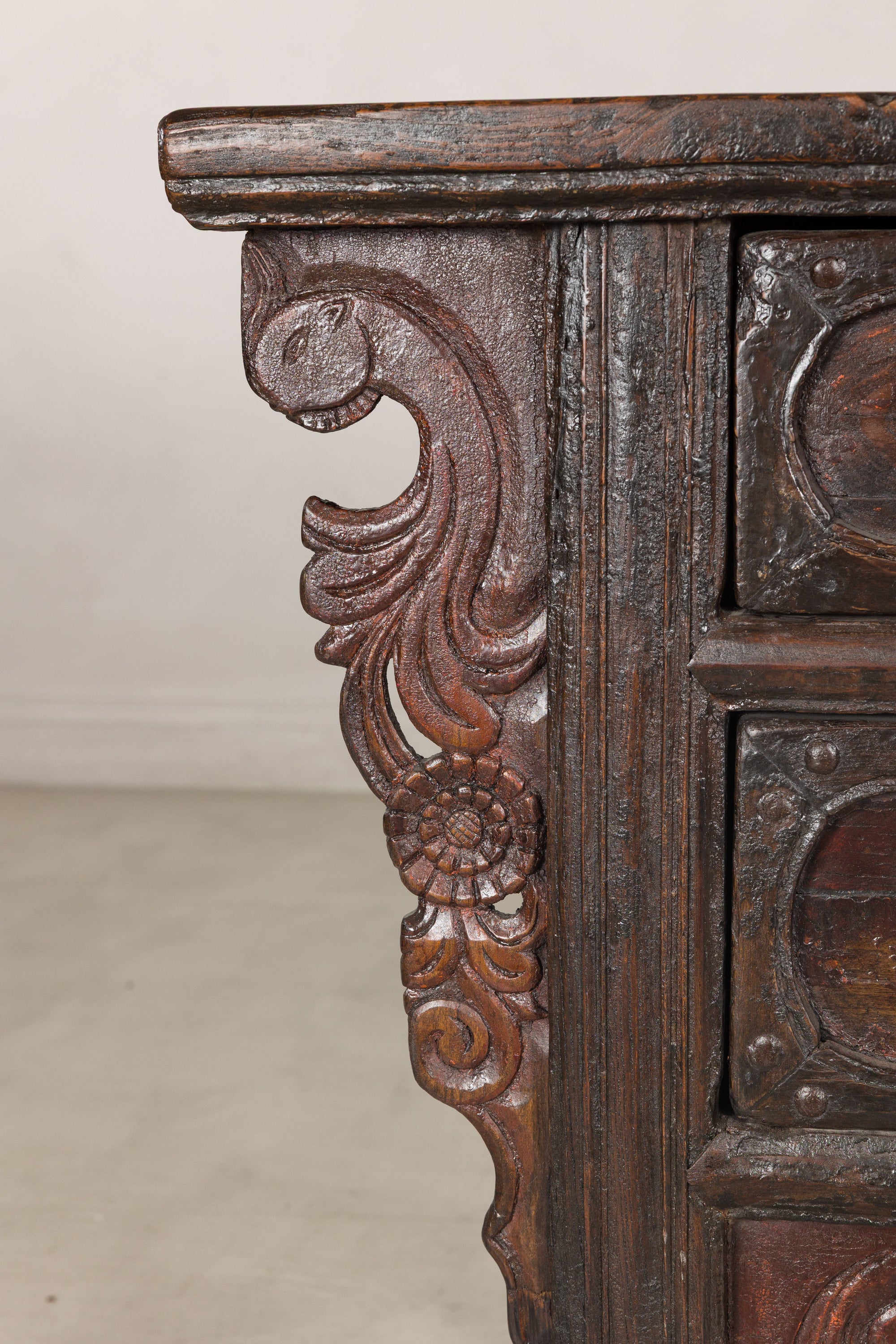 Close-up of carved cabinet side bracket