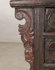 Close-up of carved cabinet side bracket
