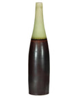 Charcoal ceramic vase with moss green glazed neck, bottle silhouette, artisan finish, close-up.