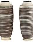 Brown and white ceramic vases with horizontal swirl design, hand-thrown, close-up on plain background.