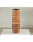 Orange-brown ceramic vase with swirl design, artisan style, on white pedestal against neutral background.