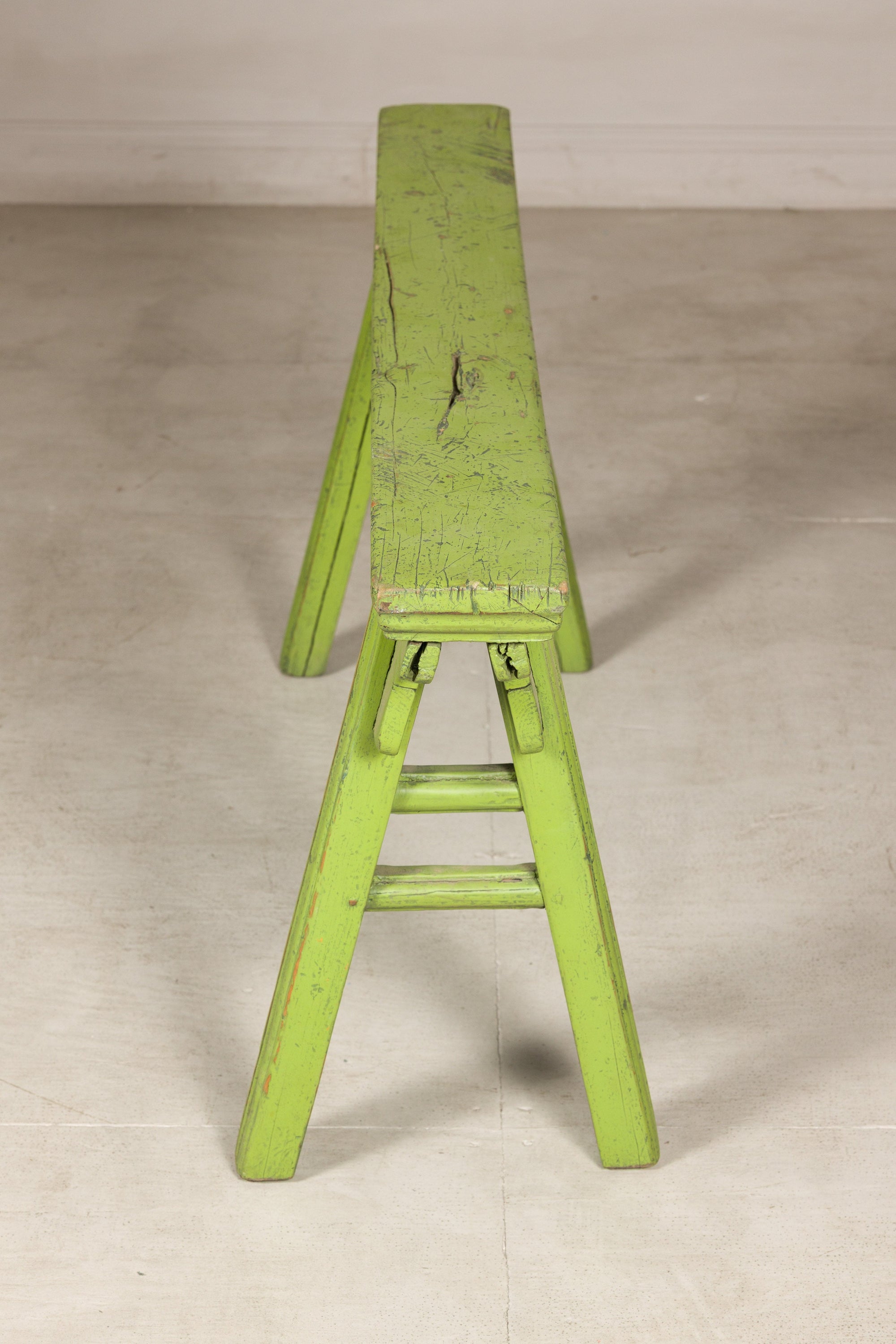 Opposite end view of green bench and A-frame support