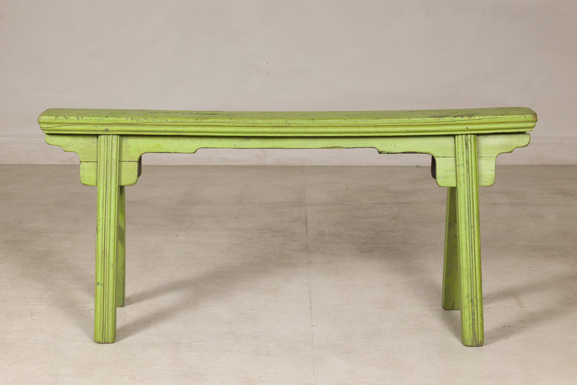 Green painted wooden bench, straight-on front view