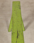Top view of green bench seat showing worn paint