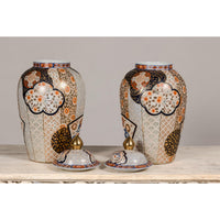 Arita Style Lidded Jars with Gold, Blue and Orange Floral Motifs