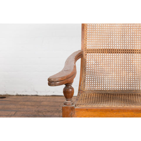 Dutch Colonial Indonesian Cane and Wood Plantation Chair with Extending Arms