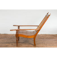 Dutch Colonial Wood and Rattan Lounge Chair with Slanted Back and Carved Finials