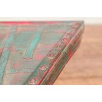 Rustic Red and Green Coffee Table with Trapezoidal Top and Iron Stretchers