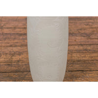 Subtle Ivory Color Tall Vase with Raised Scrolling Motifs and Narrow Mouth