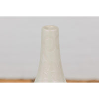 Subtle Ivory Color Tall Vase with Raised Scrolling Motifs and Narrow Mouth