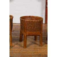 Brown Woven Rattan Baskets With Friezes on Raised Legs