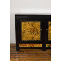 Low Yellow and Black Cabinet with Three Door Paintings