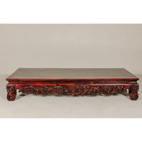 Qing Dynasty Low Kang Coffee Table with Reddish Brown Finish and Carved Décor