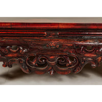 Qing Dynasty Low Kang Coffee Table with Reddish Brown Finish and Carved Décor