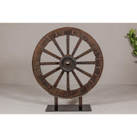 Antique Mounted Wood and Metal Wheel Welded to a Custom Metal Base