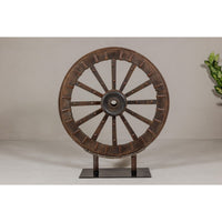 Antique Mounted Wood and Metal Wheel Welded to a Custom Metal Base