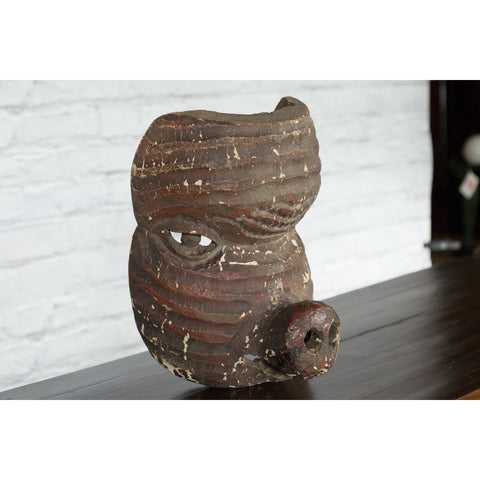 Antique Thai Tribal Carved Wooden Mask Depicting a Swine with Pierced Eyes